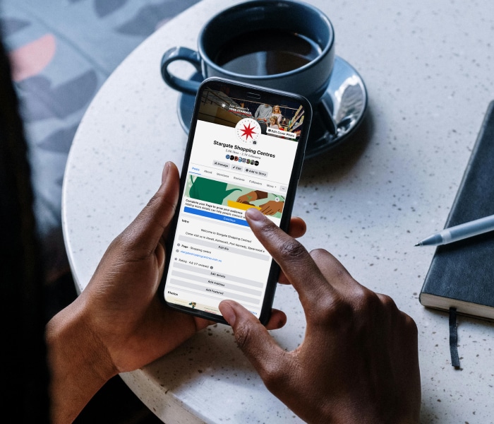 A user scrolls through the Stargate Shopping Centres Facebook page which showcases stargates Tennant marketing services